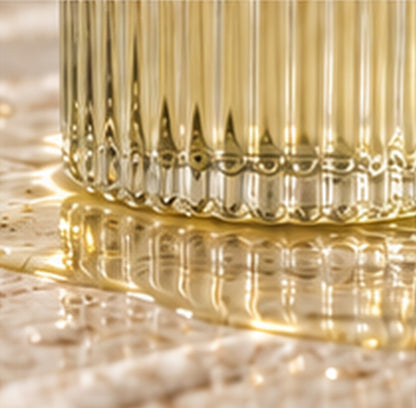 Close detail of the ribbed glass bottle